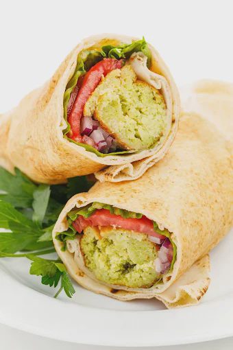 Falafel wrap with lettuce, tomato and onion, from Shawarma & Kebab Fresh’s Google owner photos.